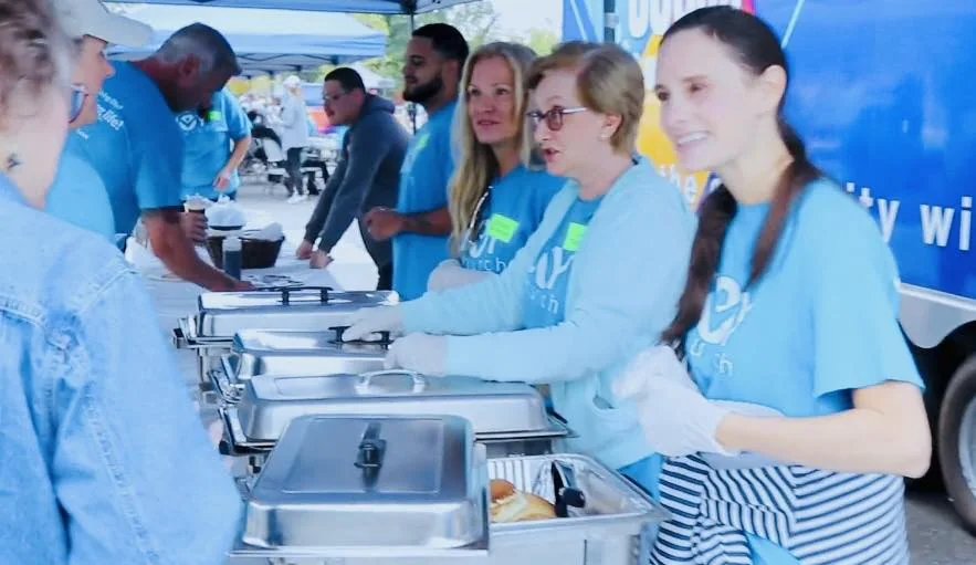 Volunteers serving a community meal