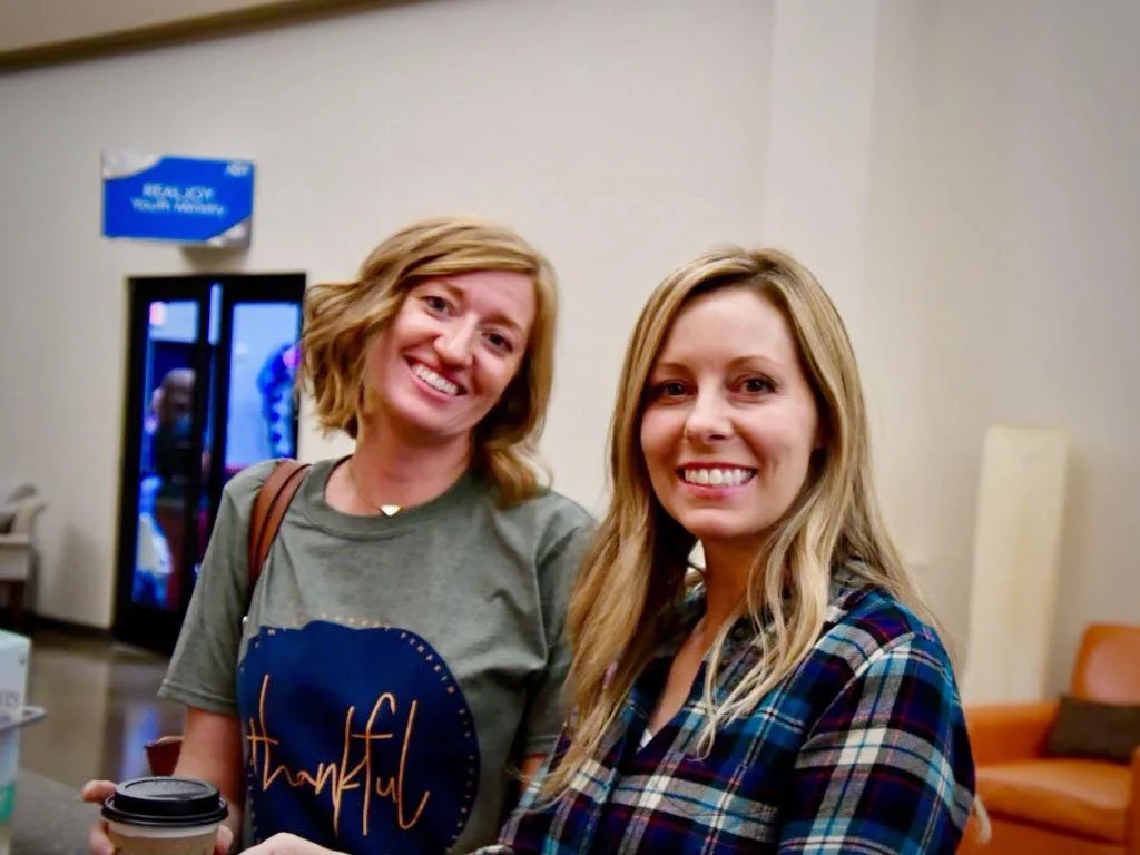 Two friends with coffee at Kairos Coffeehouse