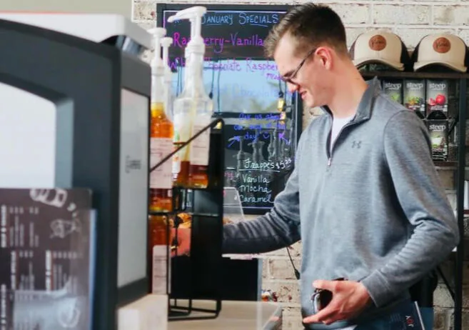 A guest ordering at the Kairos counter