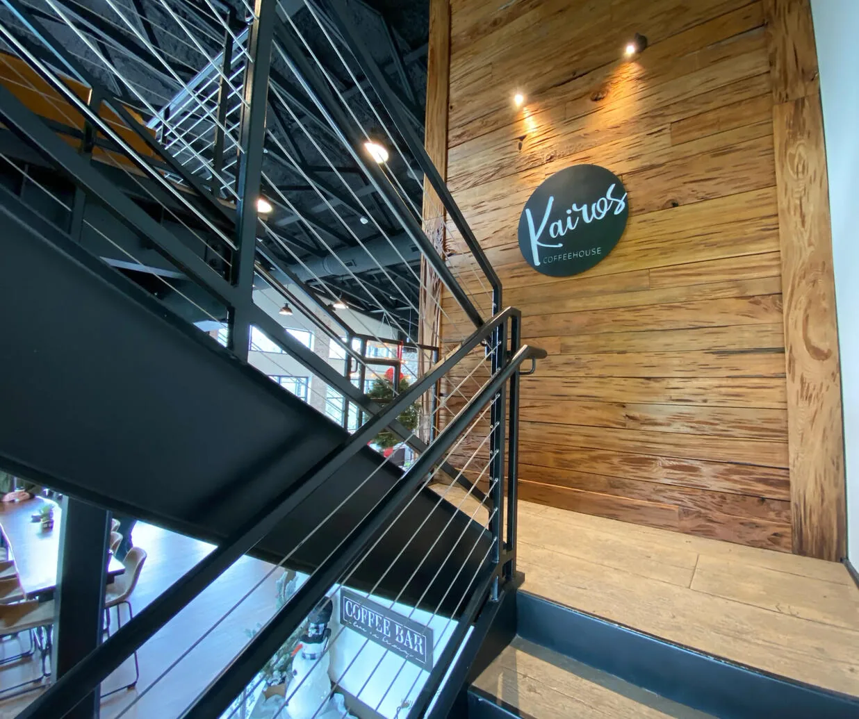 The Kairos Coffeehouse logo above the stairwell