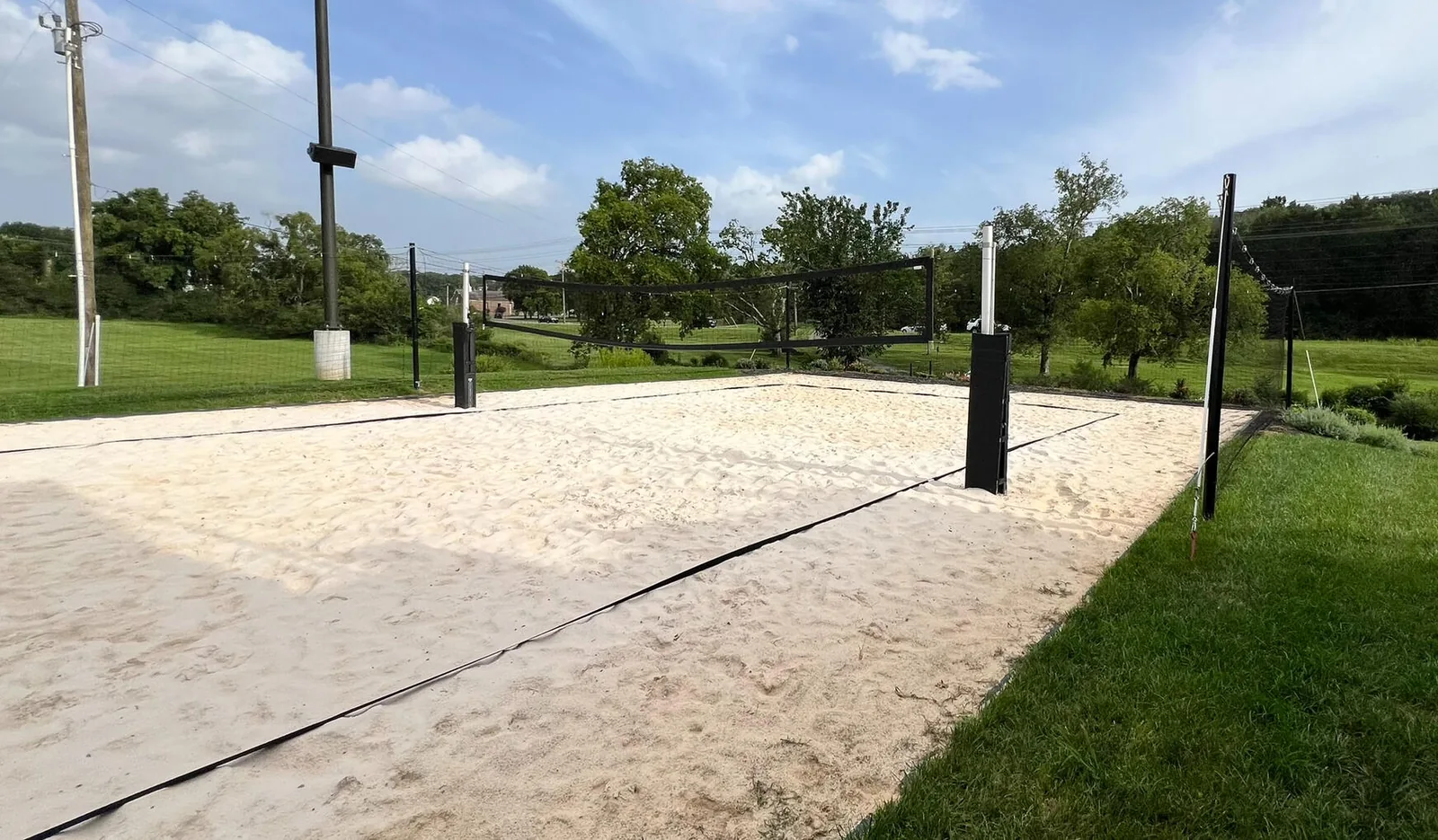 The two outdoor sand volleyball courts at Kairos