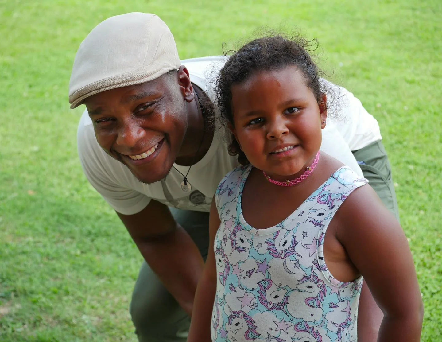 A volunteer with a young neighbor at an outreach