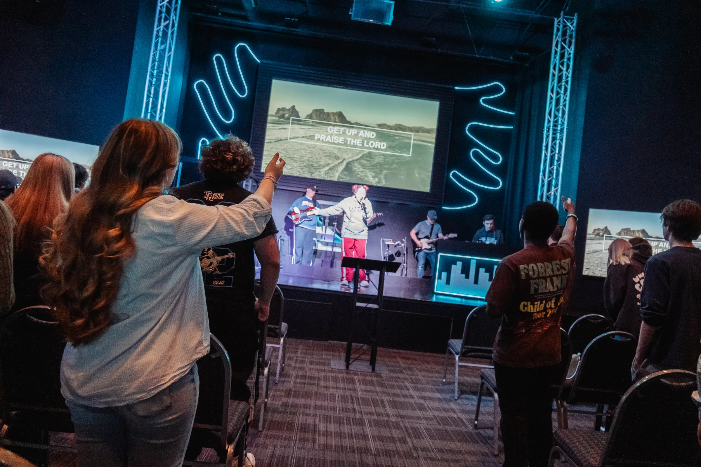 Students singing along during worship