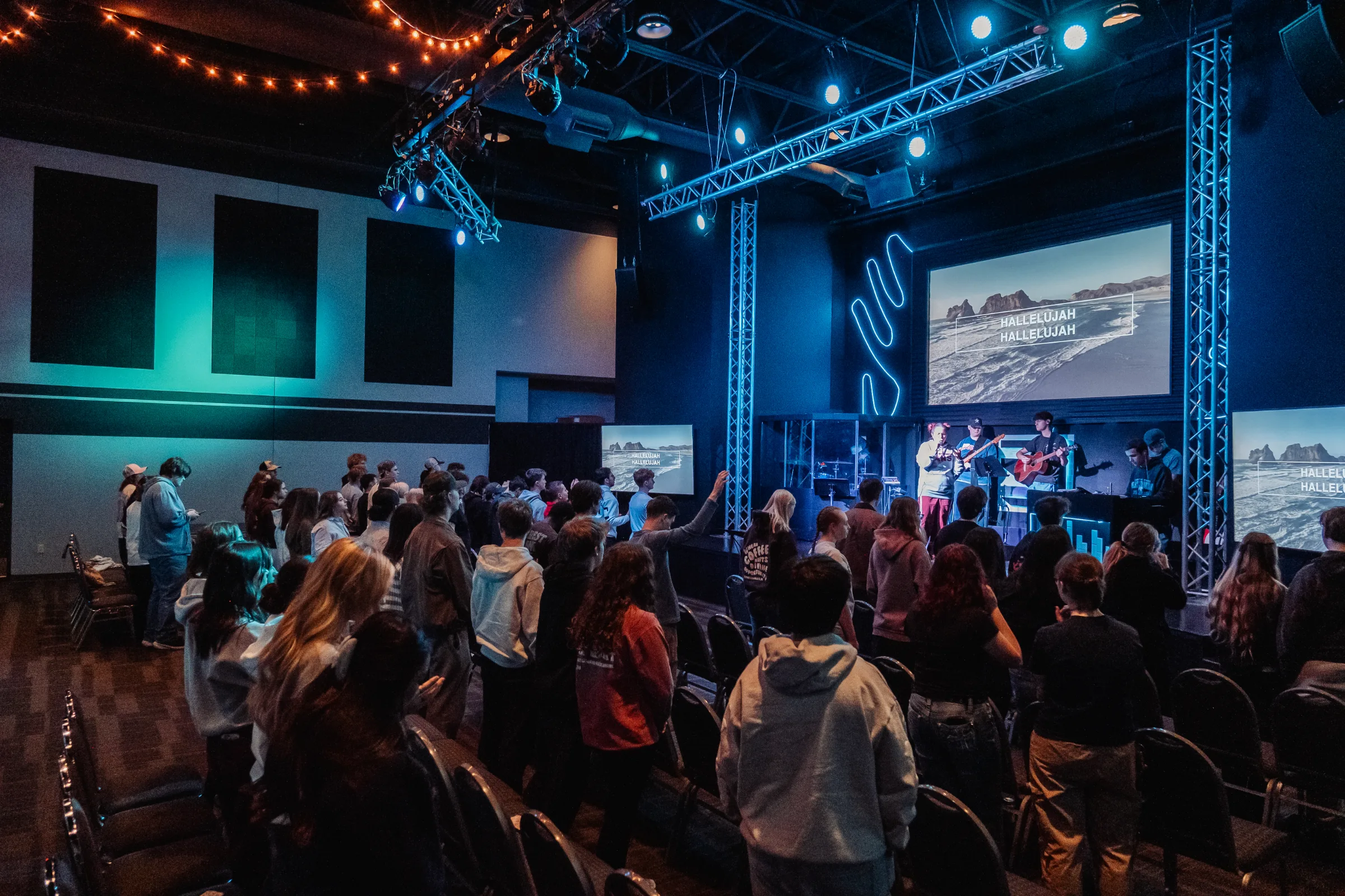 The room full of students during worship
