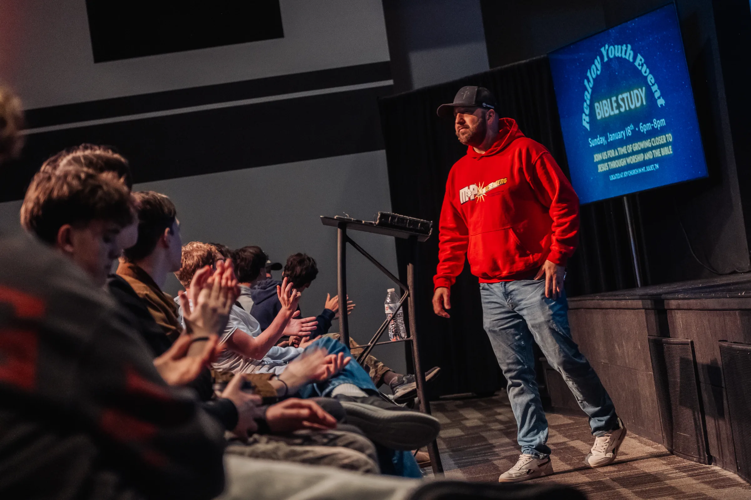 Pastor talking with students